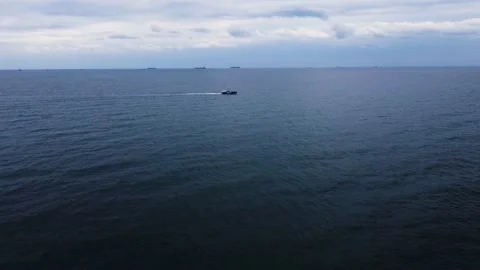 Drone view. flight over the black sea. sunny weather. small boat goes by sea Stock Footage 160422018