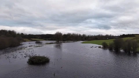 Drone View of Flooded River and Fields Under Overcast Sky Stock Footage 332504762