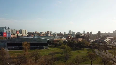 Drone view of Flushing Aquatic Center with NYC skyline/traffic Stock Footage 106717830