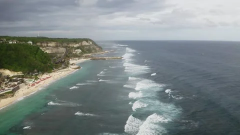 Drone view fly over the beautiful coastline with waves in Bali, 2K Stock Footage 246163673