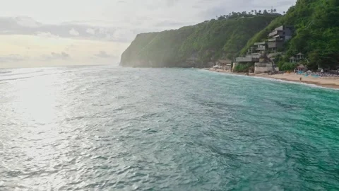 Drone view fly over beautiful ocean waves, sunset in Bali, 2K Stock Footage 246163925