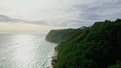 Drone view fly over beautiful coastline with cliff, sunset in Bali, 2K Stock Footage 246163940