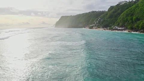Drone view fly over the sea and wave, sunset in Bali, 2K Stock Footage 246163674