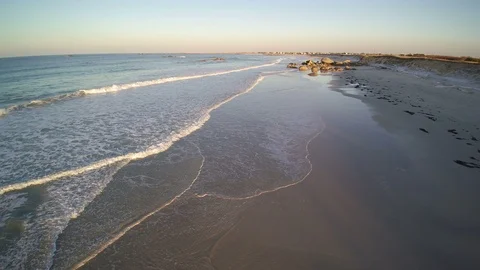 Drone view, flying forward along the seashore - nobody on the long beach. Stock Footage 86556919