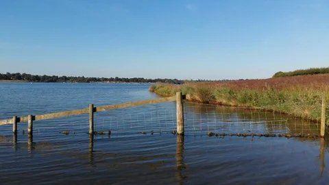 Drone View Flying Low Over Flat Lake Shore Rutland Water Reservoir 4K Stock Footage 113006085