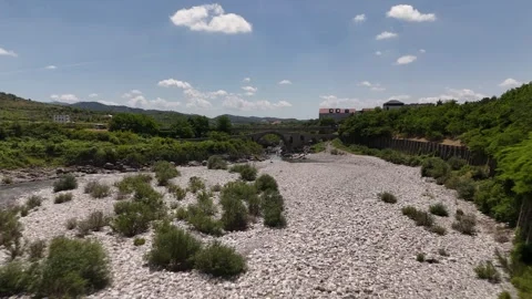 Drone View Flying Low Over River Toward Mesi Bridge Albania, 4K Vídeos de archivo 337178501