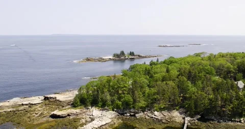 Drone view flying out from New Harbor, Bristol, Maine. Little Island can be Stock Footage 345716443