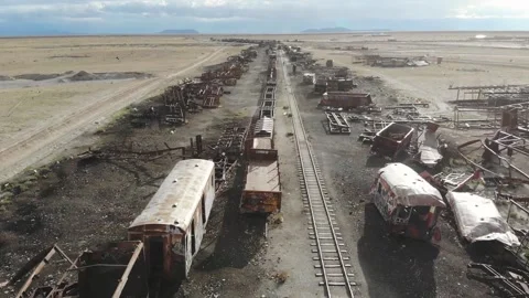Drone View Flying Over A Metal Dump Of Old Trains Along A Railway Track Stock Footage 191773459