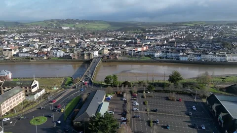 Drone view flying over the road bridge over the River Taw in Barnstable, Devon Stock Footage 302909992