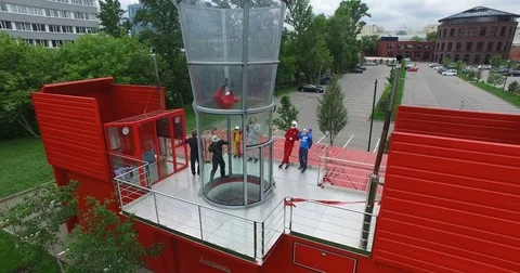 Drone view flying skydiver in training wind tunnel. Extreme parachuting Видео 82253211