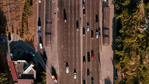 Drone view Flying straight camera trimmed down on cars passing below. Stock Footage 111876385
