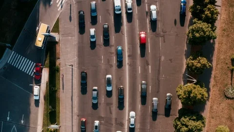 Drone view Flying straight camera trimmed down on cars passing below. Stock Footage 111876493