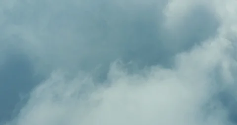 Drone view flying through a cloudscape under blue skies Stock Footage 118174854