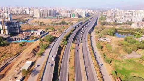 Drone view flyover connects city roads to rural expressway Stock Footage 304852234