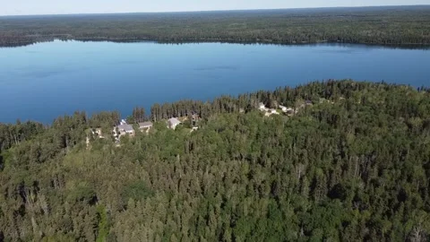 Drone view flyover of lake and forest in Manitoba in the summer Stock Footage 203233617