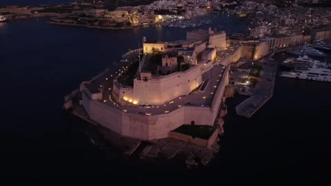 Drone view of Fort St. Angelo and yacht marina at sunset, Birgu, Malta. Stock Footage 247319612