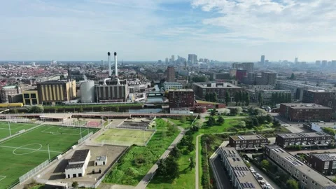 Drone view forward moving at power station and city skyline Stock Footage 347045534