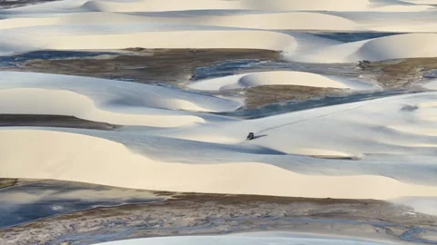 Drone View of a Four-Wheel-Drive Tour Vehicle on a Sand Ridge Between Lagoons Video stock 342443651