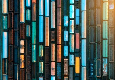 Drone view of freight trains at sunset. Railway cargo wagons with goods on .. 스톡 사진