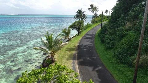 Drone View of French Polynesia Island, Coastal Road, Coral Reefs and Lagoon Video stock 348082953
