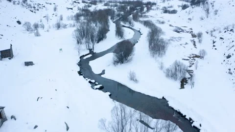 Drone view of frozen low alpine landscape on overcast day 4k Stock Footage 143361189