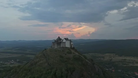 Drone view of Füzér Castle over the Zemplén Mountains during cloudy sunset Stock Footage 340106920