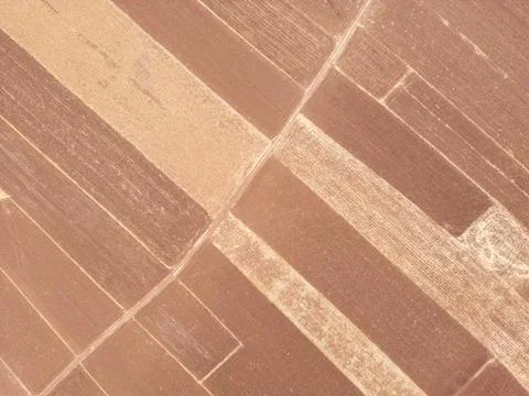 Drone view of geometric farmland fields and rural landscape Stock Photos
