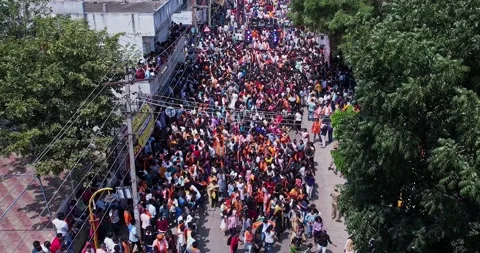 Drone view of girls dancing joyfully during immersion of lord Ganesha Stock Footage 340083960