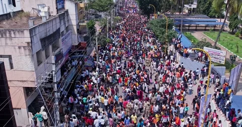 Drone view of girls dancing joyfully during immersion of lord Ganesha Stock Footage 340084192