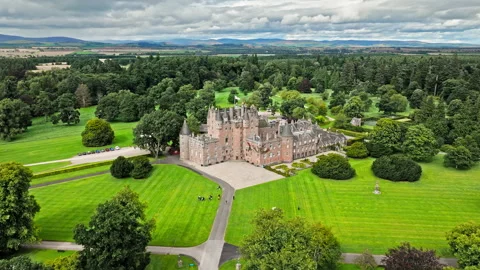 Drone view of Glamis Castle with towers and beautiful garden in Scotland. Stock Footage 283397148
