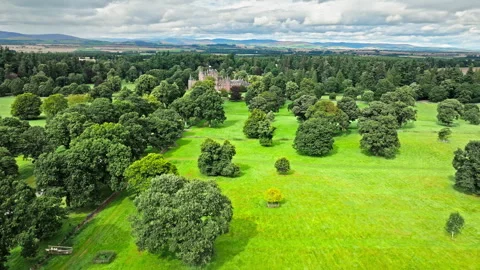 Drone view of Glamis Castle with towers and beautiful garden in Scotland. Stock Footage 283397374