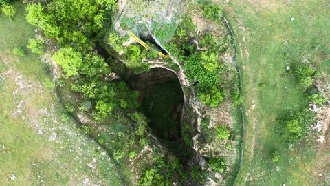 Drone View of Golyama Garvanitsa Cave in the Devetashko Plateau, 2019 Stock Footage 323163379