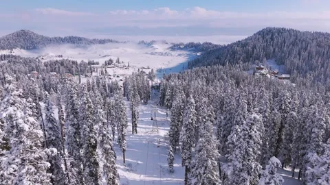 Drone view of gondola in mist-covered alpine terrain. Stock Footage 311946804