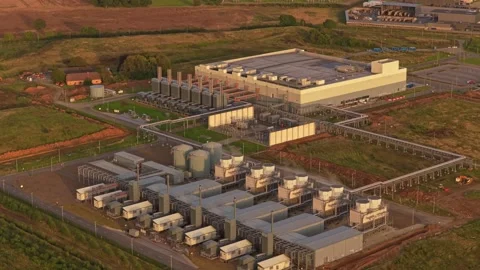 Drone view of Google network hub glowing under sunset sky Stock Footage 318620301