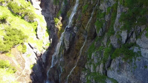 Drone View from Gorge to Waterfall Flowing from Unterer Gaisalpsee Stock Footage 282309404