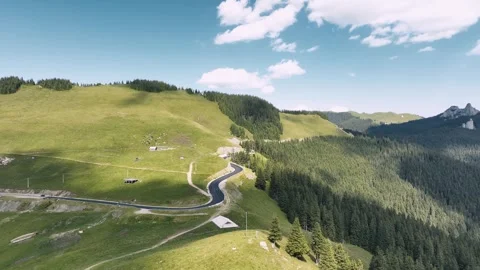 Drone view of gorgeous mountain landscape with asphalted road Stock Footage 247641643