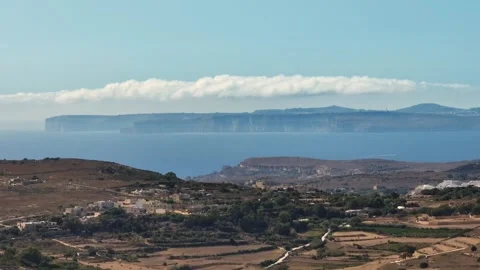 Drone view of Gozo island, cliffs, Maltese countryside. Clouds and sky Stock Footage 278870595