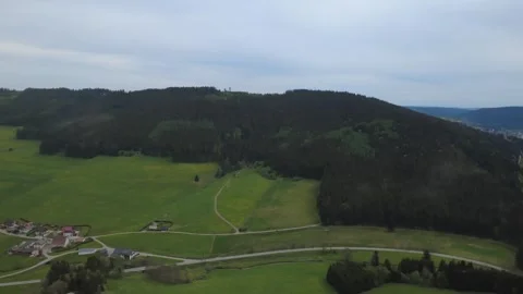Drone view of green countryside fields and farms on a bright spring day Stock Footage 336626869