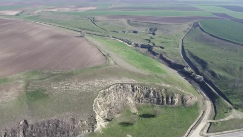 Drone View of Green Expanse with Rolling Hill Stock Footage 255982207