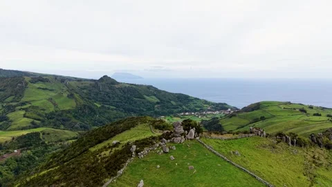 Drone View Of Green Highlands And Coastal Village On Flores Island Azores Stock Footage 337698747