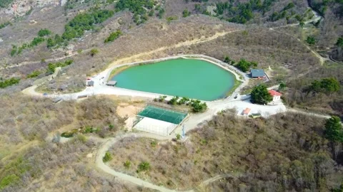 Drone View of a Green Mountain Lake Stock Footage 247958341
