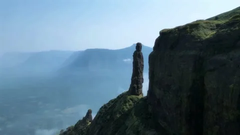 Drone View of Green Mountain Ridge Facing a Tall Peak with Scenic Sky Stock Footage 287751065