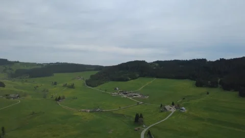 Drone view of green spring fields and rural village on a sunny day. Stock Footage 336678497