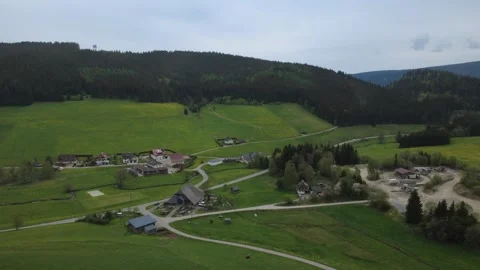 Drone view of green spring fields and rural village on a sunny day. Stock Footage 336678535