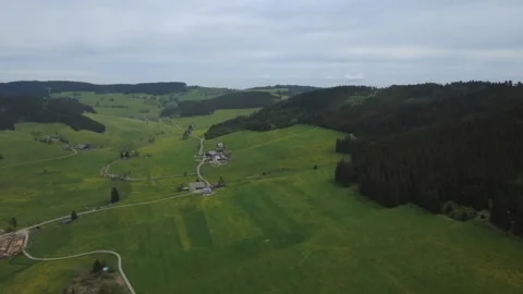 Drone view of green spring fields and rural village on a sunny day. Stock Footage 336678584