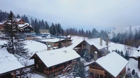 Drone view of a group of buildings covered in snow Stock Footage 255491407