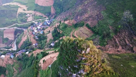 Drone View of Ha Giang's Mountain Peak and Rural Village with Rice Fields Stock Footage 280373523