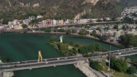 Drone view of Haridwar with highway traffic, Shiva statue, and Ganga River Stock-Footage 333475872