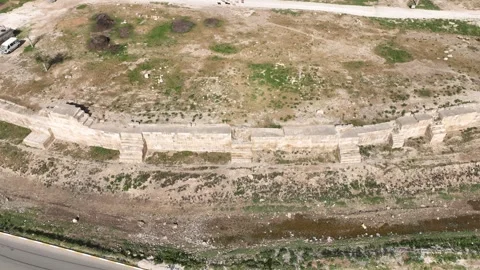Drone view of Harran castle walls and ancient fortress ruins in Sanliurfa Stock Footage 324114400