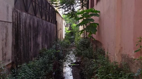 Drone view of heavily polluted Bengaluru canals with foul-smelling water po.. Stock Footage 340500149